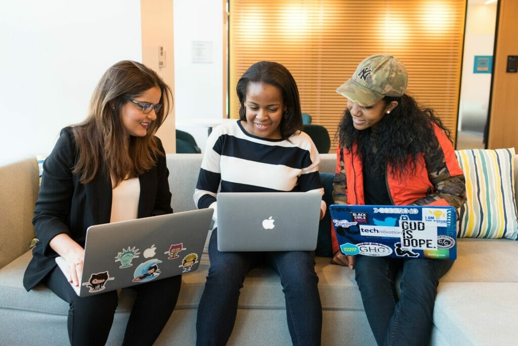 Three co-workers looking at how to improve their organizational structure. - Sociocracy For All