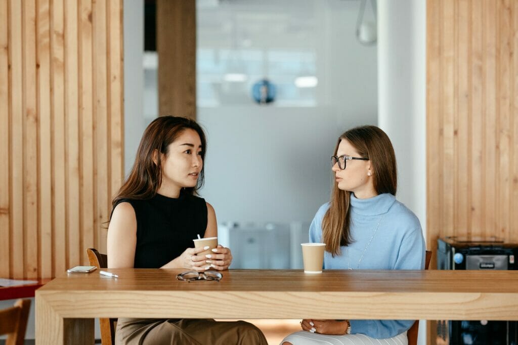 Two people speaking to each other following nonviolent communication principles