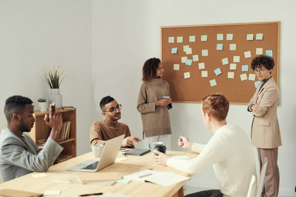 People standing in a meeting problem solving